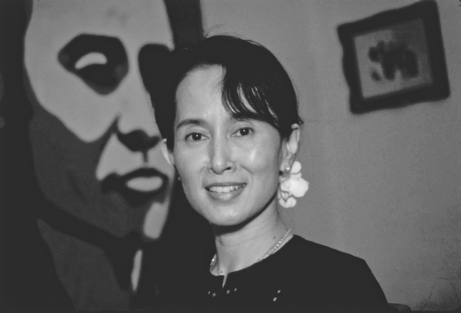 Portraits — Daw Aung San Suu Kyi In Front Of Portrait Of Her Father Bw